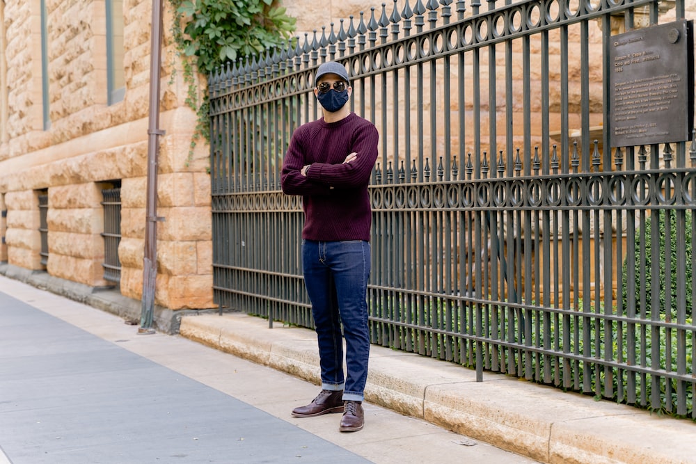 Man In Maroon Long Sleeve Shirt And Blue Denim Jeans Standing On Sidewalk  During Daytime Photo – Free Usa Image On Unsplash